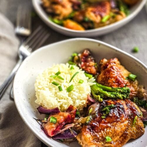 Plum chicken with hoisin sauce in bowls with rice