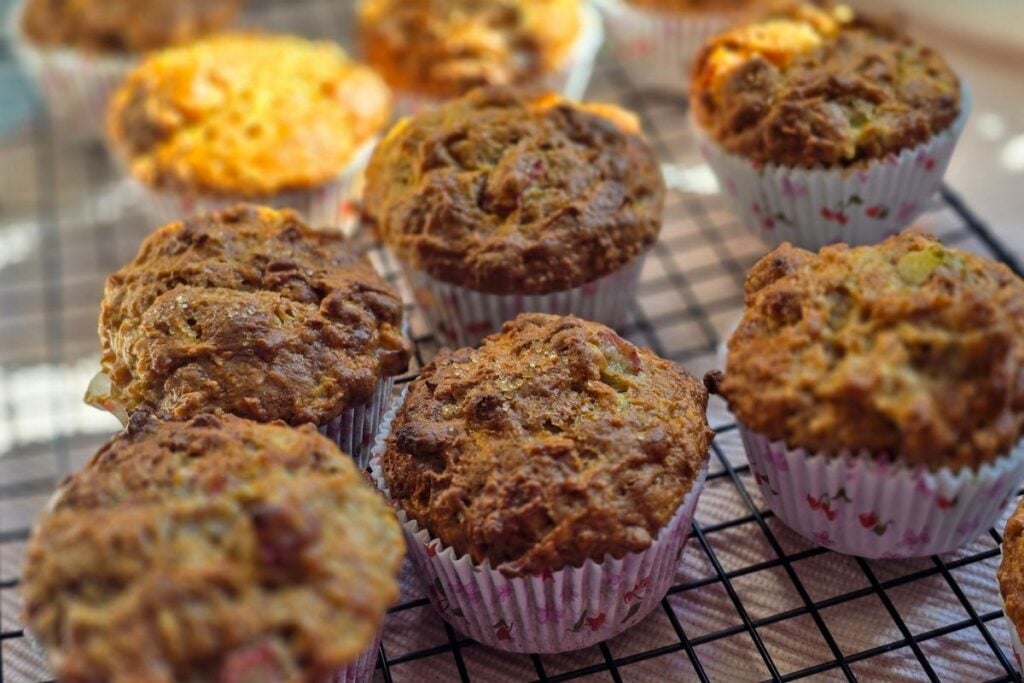 crunchy top muffins on a black cooling grid