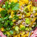 Chunky avocado pineapple salsa with diced pineapple, avocado, shallot, coriander, and chili flakes.