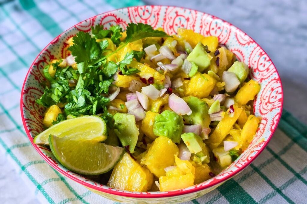 Avocado pineapple salsa with lime, coriander, shallot, chili flakes, and diced fresh pineapple.